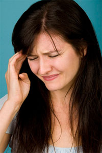 Woman suffering from migraine headache